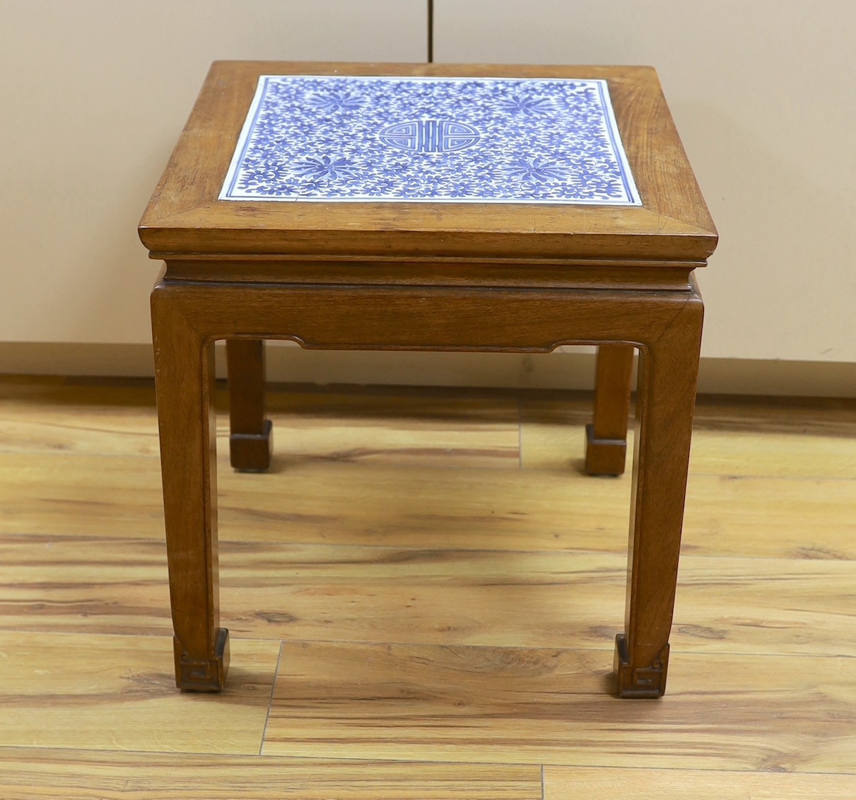 A Chinese hardwood and blue and white porcelain inset table, 42cm square